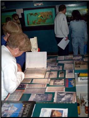 Visitors Viewing 70th Anniversary Artifacts